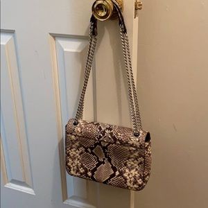 Michael Kors crossbody NWOT, yet never carried.